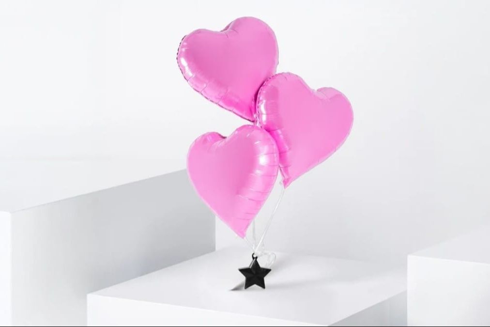 3 pink heart balloons
