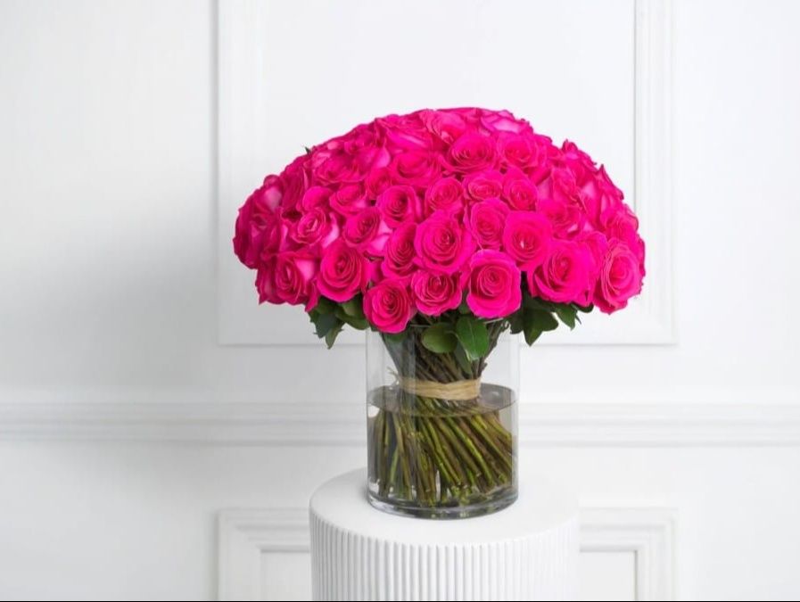 100 Fuchsia Pink Roses In Vase